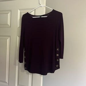 Sweater with buttons on the sides